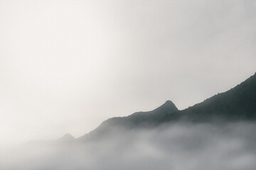Mist covering mountains in the background