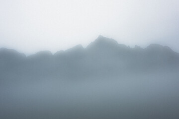 Mist covering mountains in the background