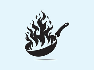 Dramatic black silhouette of a frying pan with fire emerging from within