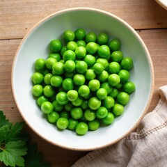 Fresh green peas in a shallow bowl on wooden table, surrounded by natural light , peas, fresh