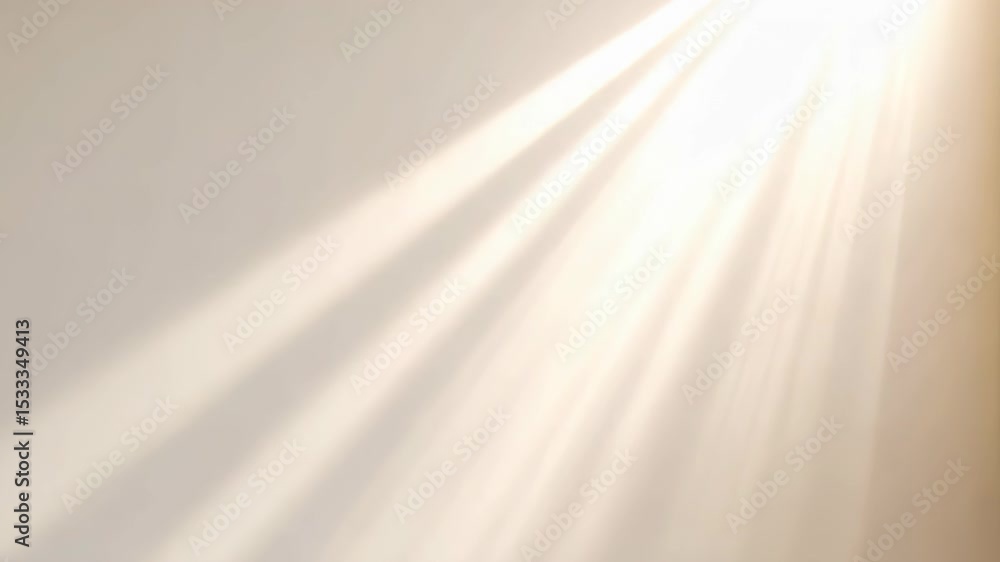 Poster sunlight streams through a window, casting soft, illuminating rays on a cream colored wall, creating