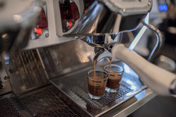 coffee machine making two cups of coffee