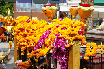 Marigold flower garlands offered for worship at the Erawan Shrine in Bangkok, Thailand.