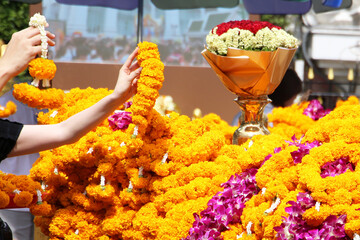 Marigold flower garlands offered for worship at the Erawan Shrine in Bangkok, Thailand.