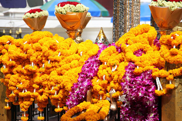 Marigold flower garlands offered for worship at the Erawan Shrine in Bangkok, Thailand.