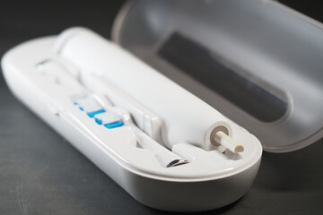 Travel dental cleaning kit on black surface