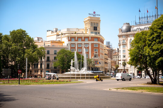 Madrid, Spain - June 1, 2025: Buildings and pedestrians along the streets in Madrid in Spain
