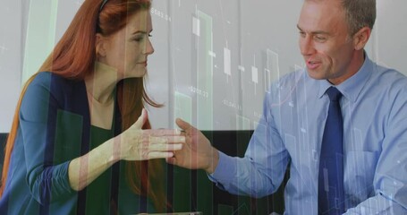 Woman tapping tablet and man reviewing, shaking hands sealing deal with floating financial charts