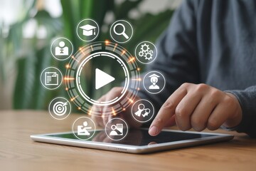 Person using a tablet with interactive video training icons.