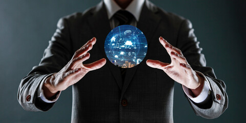 businessman holding a sphere with a globe in his hands.