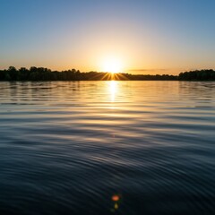 Obraz premium Serene Sunset Over Calm Lake Water