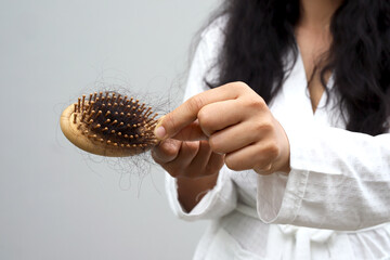Woman with hair loss dryness and frizziness