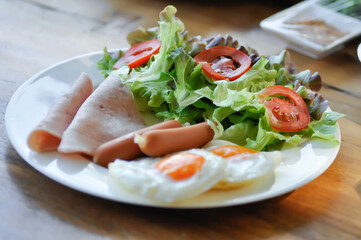egg , sausage and ham with vegetable or sunny side up egg