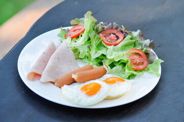 egg , sausage and ham with vegetable or sunny side up egg
