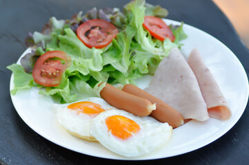 egg , sausage and ham with vegetable or sunny side up egg