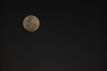 A full moon sets above the Spitzkoppe in Namibia.