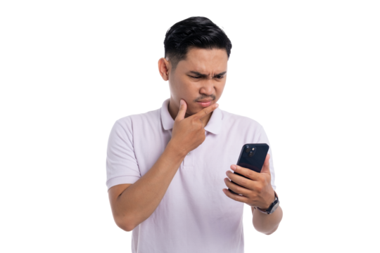Young man looking confused while reading something on his smartphone isolated on transparent background