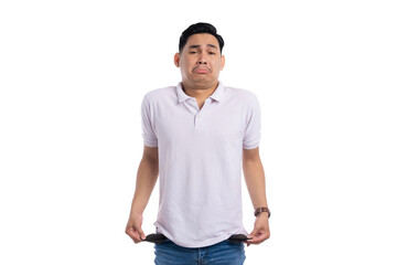 Sad man showing empty pockets with hopeless expression isolated on transparent background...