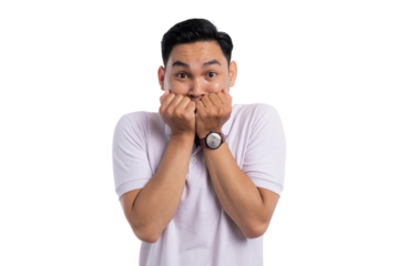 Scared man biting fists and looking terrified while facing fear or shock isolated on transparent background