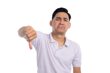 Disappointed young man showing thumbs down gesture with sad facial expression isolated on transparent background