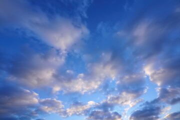 Beautiful Blue Sky with Fluffy Clouds and Soft Sunlight Display