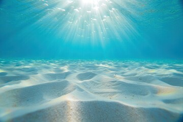 Serene Underwater Scene with Sunlight Shining Over Sandy Ocean Floor
