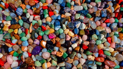 Colorful Polished Gemstones in Natural Light. Top View of Mixed Semi-Precious Stones. Geology.