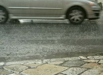 Pedestrian and car road in rainy.