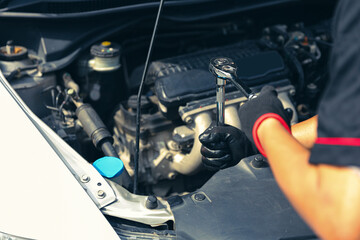 Auto mechanic uses the wrench for fix service repairing change spare part engine problem or...