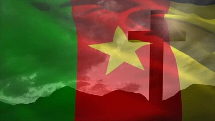 Flag of Cameroon fading in over mountain silhouette, wind-driven rippling revealing star and cross - Powered by Adobe