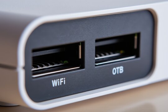 WiFi Extender concept. Close-up of a device with USB ports labeled WiFi and OTB.