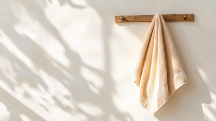 Beige towel hanging on wall