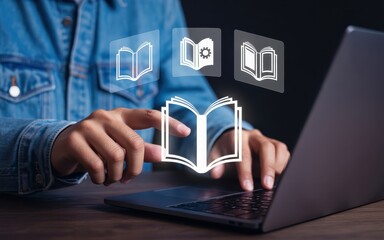 Hands interacting with digital book icons on a laptop.
