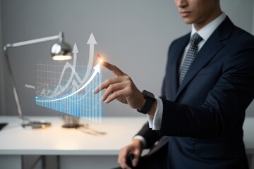 Businessperson interacting with a holographic business graph.