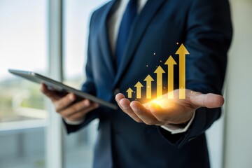 Businessperson holds a glowing upward trend graph in their hand.