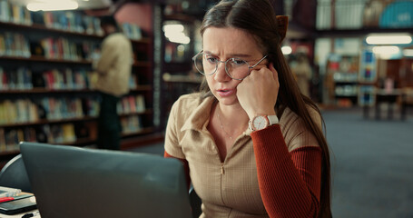 Stress, college and bored woman on laptop in library for low concentration, fatigue and student debt. University, tired and unhappy person with scholarship loss, burnout and anxiety with bad grades