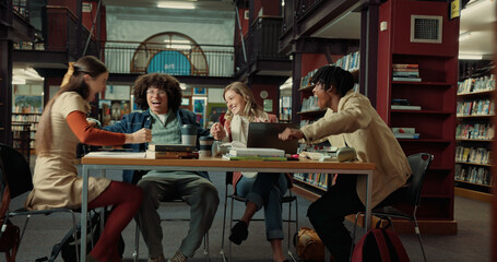 Laughing, study group and college with friends in library for research project, comedy or education. University, funny and scholarship opportunity with people on campus for academy and course