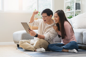 financial in family concept, Happy Asian husband and wife calculating income and bills to plan for...