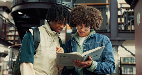 Fototapeta na wymiar People, students and book for education in library by studying, information and exams. Men, friends and reading textbook for research, knowledge and learning for assignment of scholarship preparation