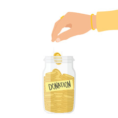 Hand putting golden coin into donation box. Glass money jar full of gold coins