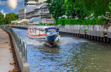 Ferry boat going through a Canal Khlong in Thai running from Soi 15 Sukhumvit Rd NANA to Soi 21...