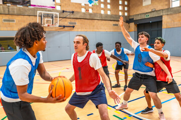 Basketball players competing during championship match in gymnasium