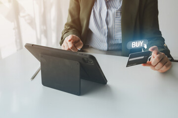 Online shopping and credit card payment concept, person is shopping on an online shopping website, purchasing goods and services securely, debiting credit card to pay for goods on the internet.