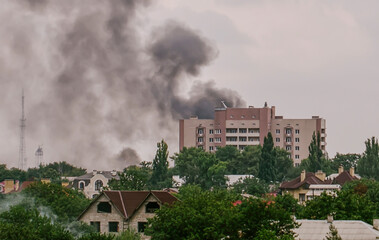 Russian invasion of Ukraine war torn city destroyed car burn out. Russia war damage building...