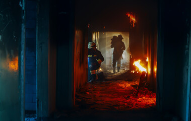 Firefighters were seen rescuing trapped people from a house fire. And men helped by fire rescue in...