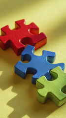 Obraz premium Feeling of completeness emanates as vibrant red, blue, and green puzzle pieces rest on table, symbolizing connection and unity
