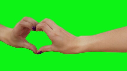 Heartfelt Gesture: A pair of hands forms a heart shape against a vivid green background, symbolizing love and connection. This image captures a moment of tenderness and affection. - Powered by Adobe