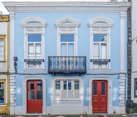 Charming Blue Azorean Townhouse With Red Doors And Ornate Details in Ponta Delgada. Traditional...