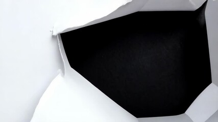 White paper with a jagged, irregular hole ripped through revealing black background, creating graphic design element, revealing information, abstract, simple - Powered by Adobe