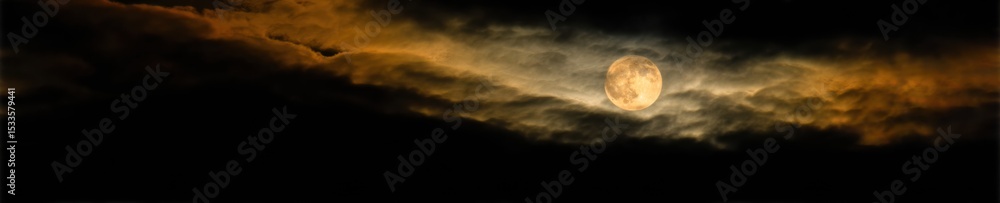 Aufkleber Moody Moonrise with Full Moon Partially Veiled by Dramatic Clouds in Night Sky - Atmospheric Digital Background for Mystical and Dreamlike Visual Content